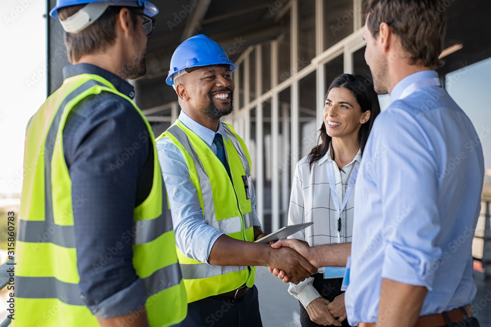 construction workers meeting on site